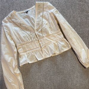 American Eagle top is ivory/cream.